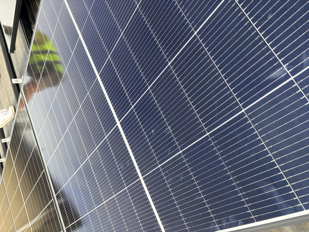 Close-up detail of a solar panel array installed by SEBSS